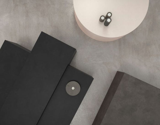View of the Blinde Design Bloc concrete coffee table in the colours graphite, natural and bone