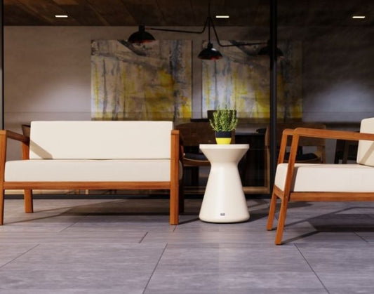 View of the Blinde Design Solo R1 Stool in the colour bone next to a sofa and chair