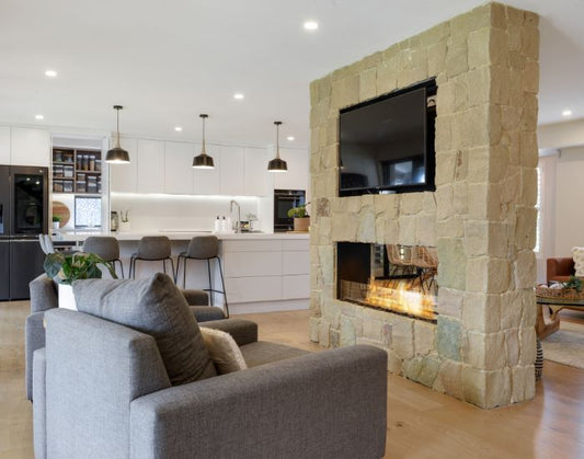 View of a living room with the EcoSmart Fire Flex 50DB Double Sided Fireplace Insert