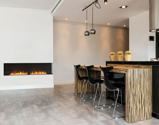View of a dining room with the EcoSmart Fire Flex 86RC Right Corner Fireplace Insert