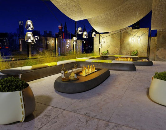 View of the EcoSmart Fire Linear 50 Bioethanol Fire Pit Kit installed in a bar table
