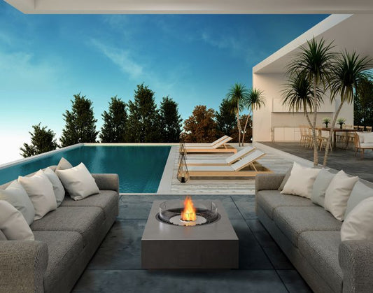 View of a seating area with the EcoSmart Fire Martini 50 Fire Pit Table in the colour natural 