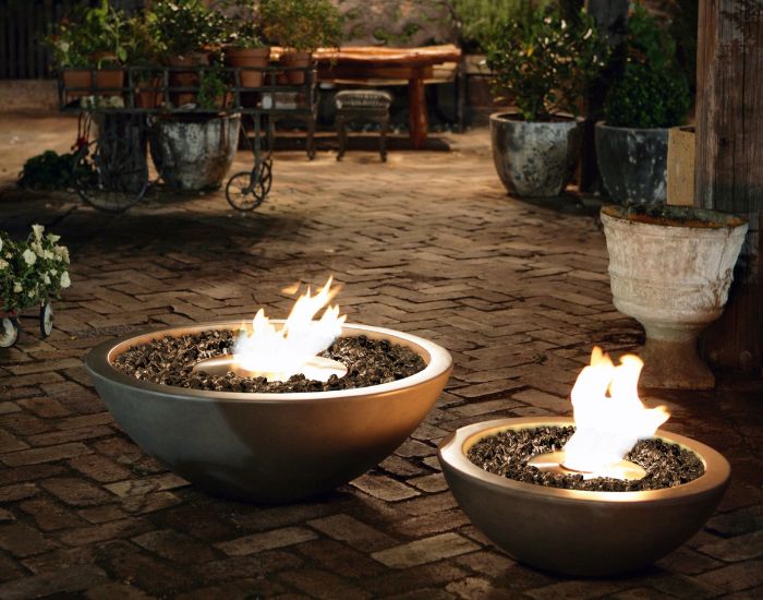 View of a garden with the EcoSmart Fire Mix 600 and 850 Bioethanol Fire Pit Bowl  in the colour natural