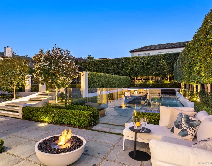View of a garden with the EcoSmart Fire Mix 850 Bioethanol Fire Pit Bowl in the colour bone
