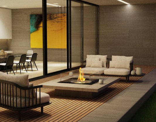 View of a porch with the EcoSmart Fire Square 22 Bioethanol Fire Pit Kit next to a sofa