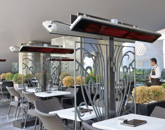 View of a restaurant with several Heatscope Vision 3200w Radiant Heaters in the colour black mounted on the wall