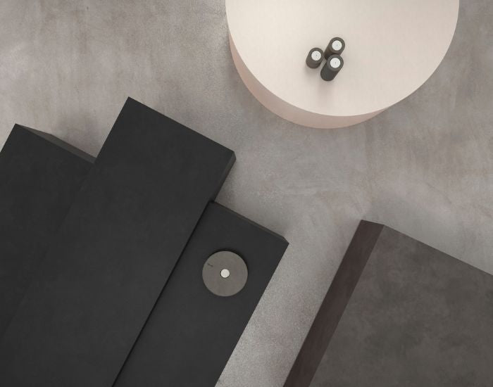 View of the Blinde Design Circ concrete coffee table in the colours graphite, natural and bone