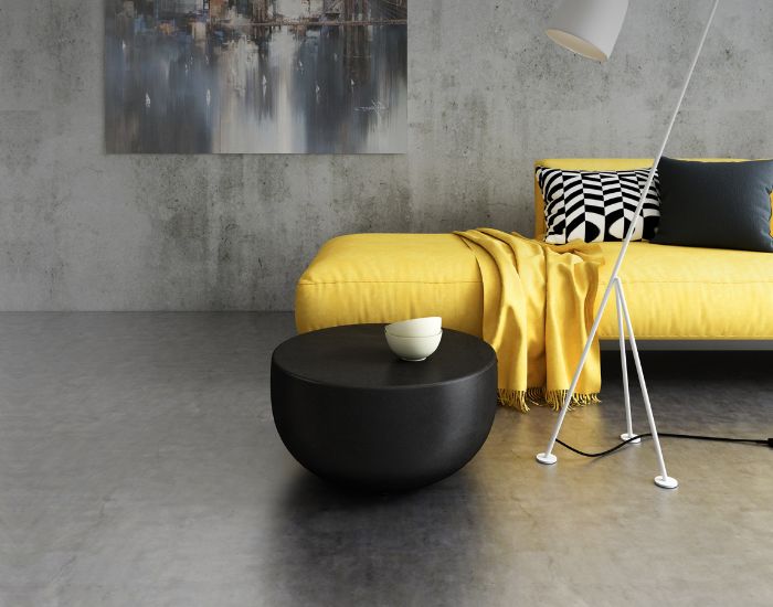 View of a sofa and the Blinde Design Circ M1 concrete coffee table in the colour graphite